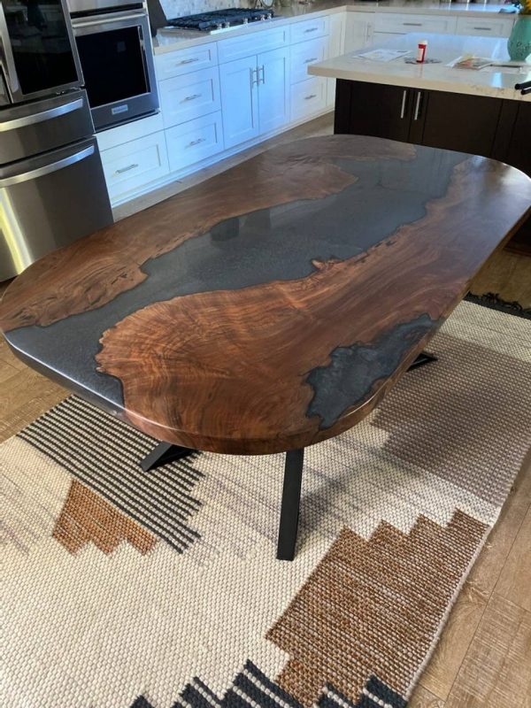Black walnut table with dark grey epoxy river